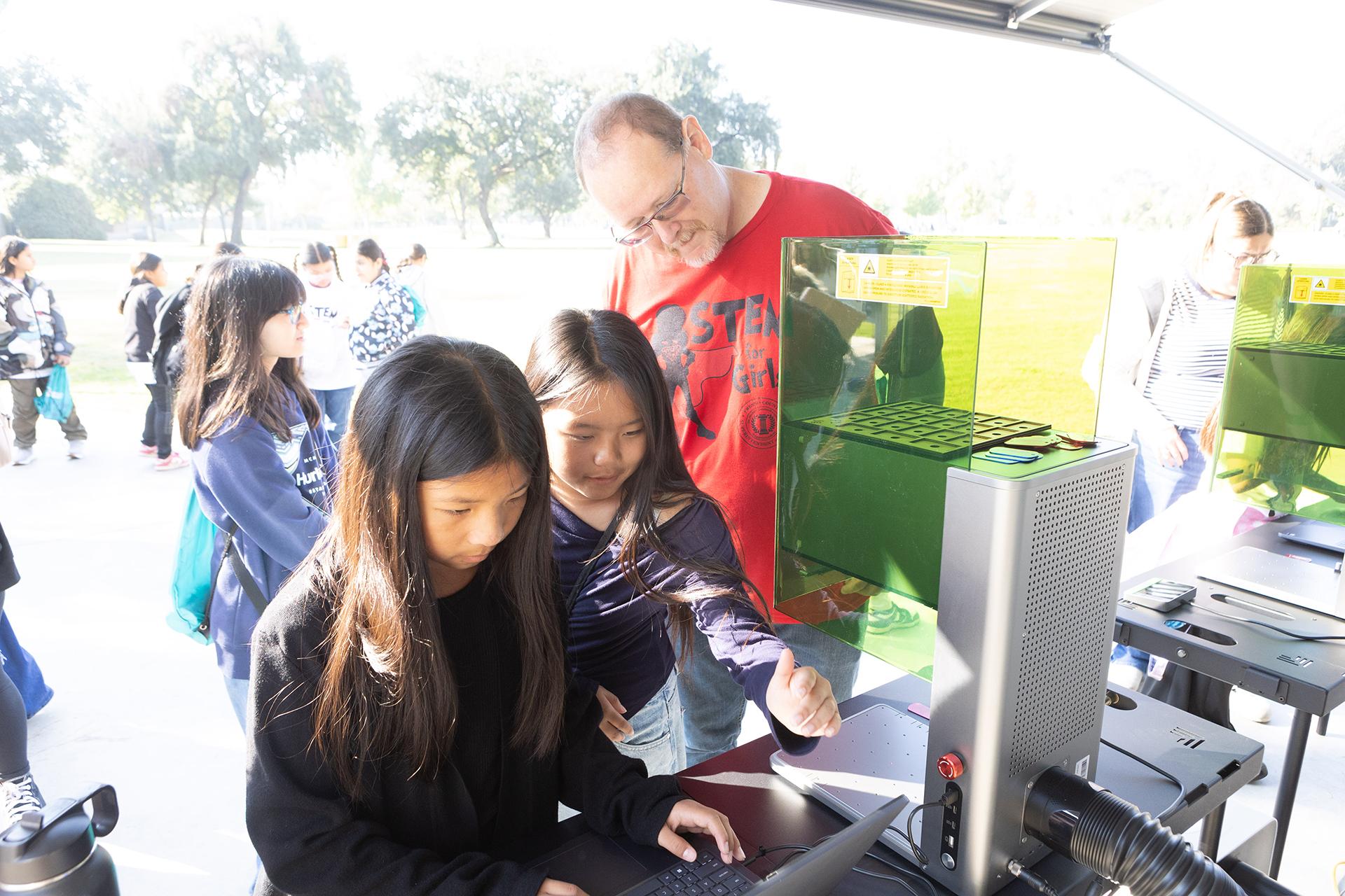 participants in the STEM for Girls Conference create their own name tags