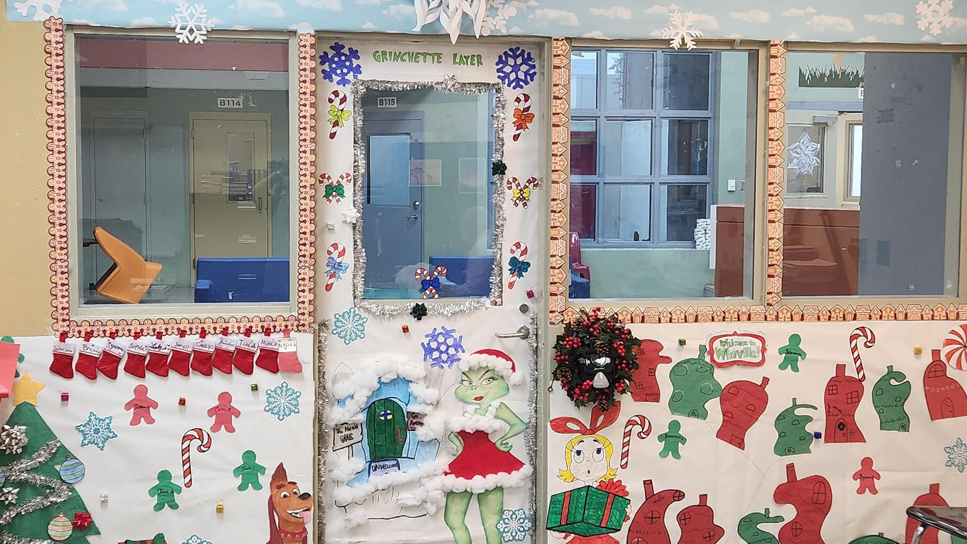 The outside of a classroom is decorated in a Whoville theme.