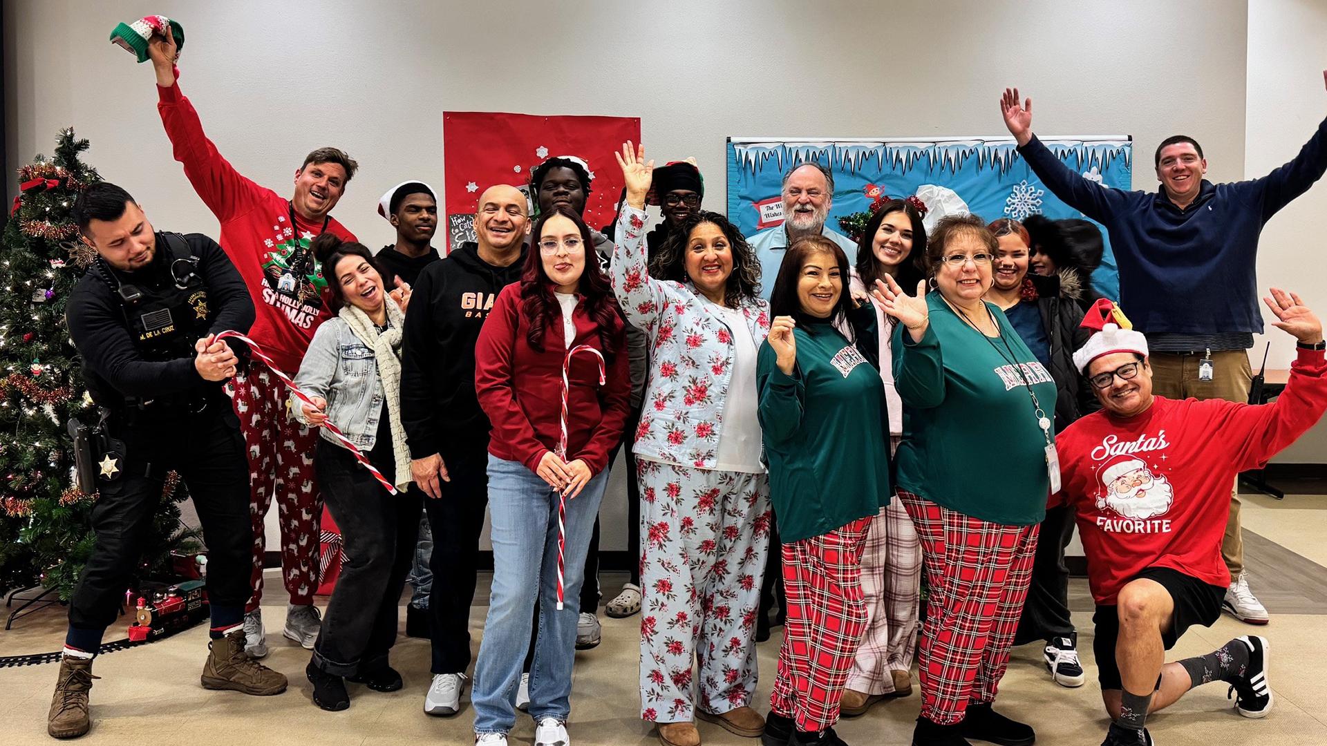 School staff and students pose with funny expressions for Pajama Day.