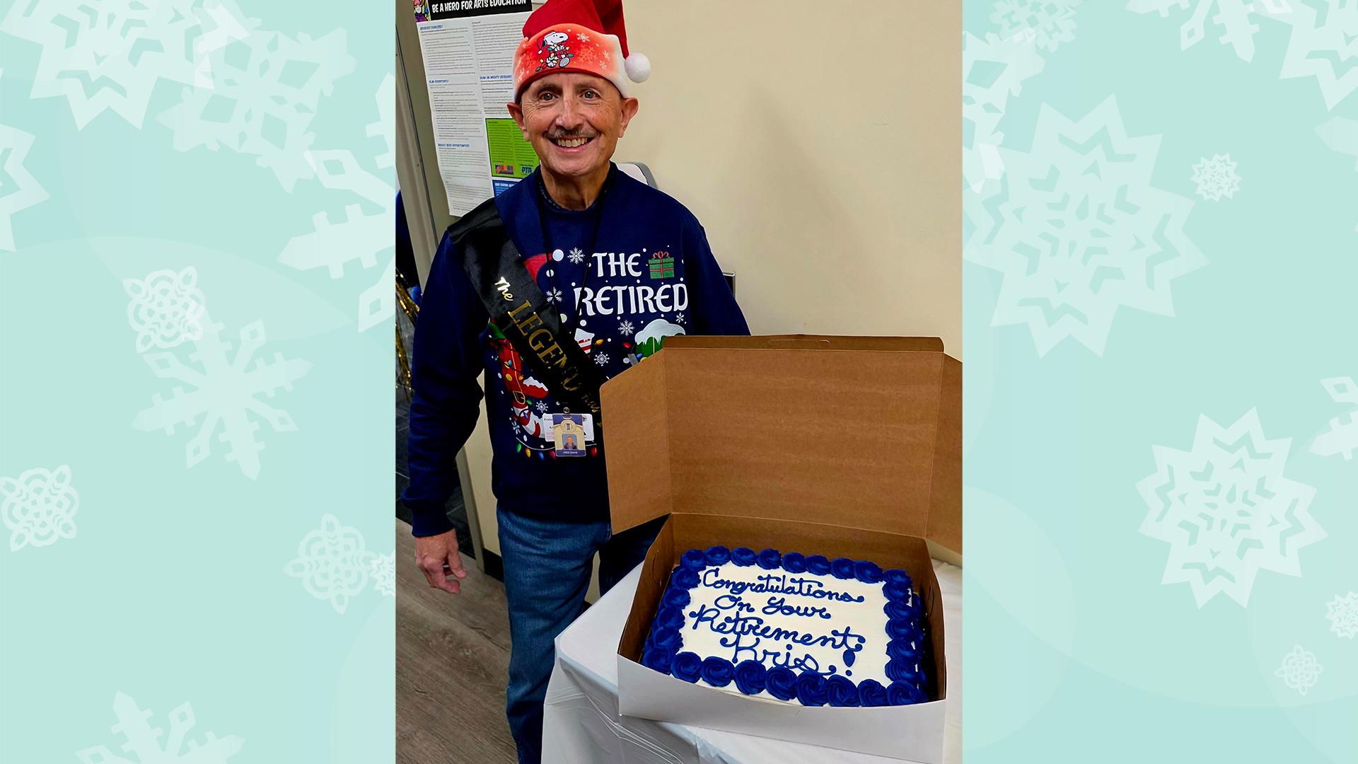 The retiree is smiling with his decorated retirement cake.