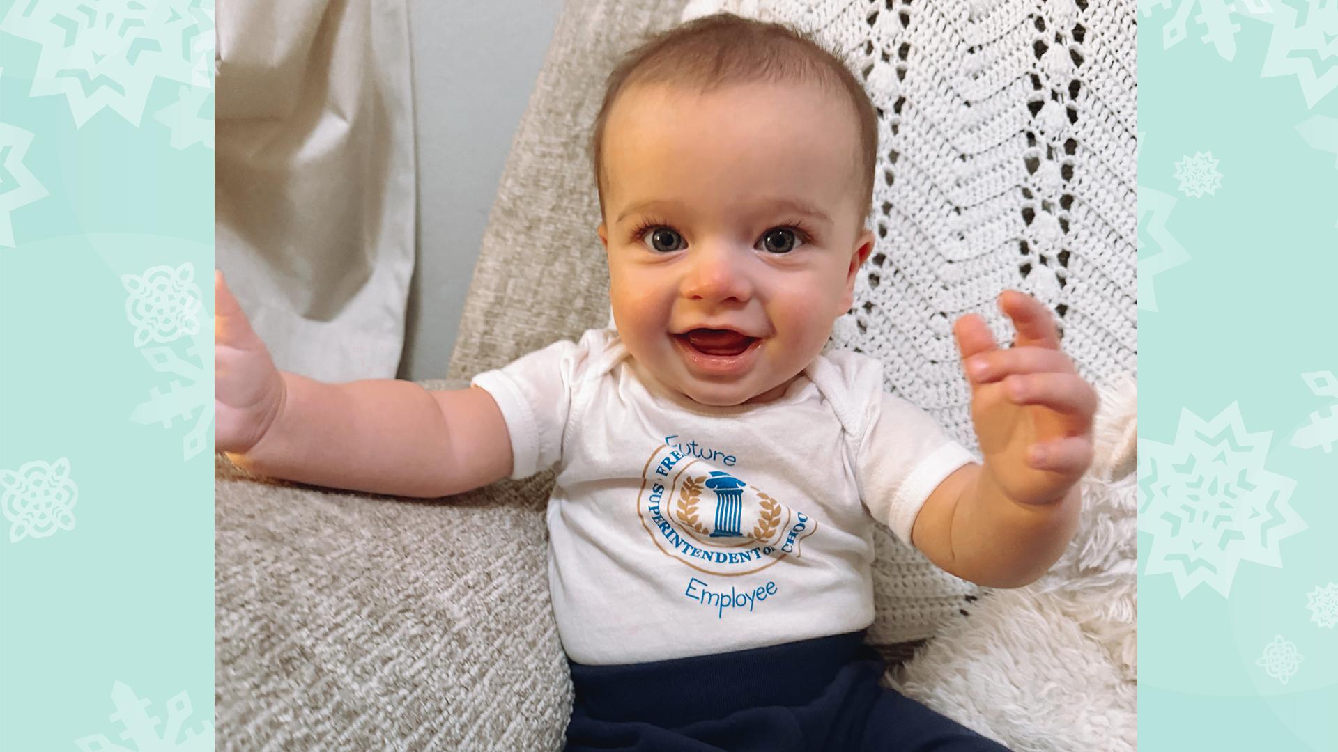 The baby is smiling.