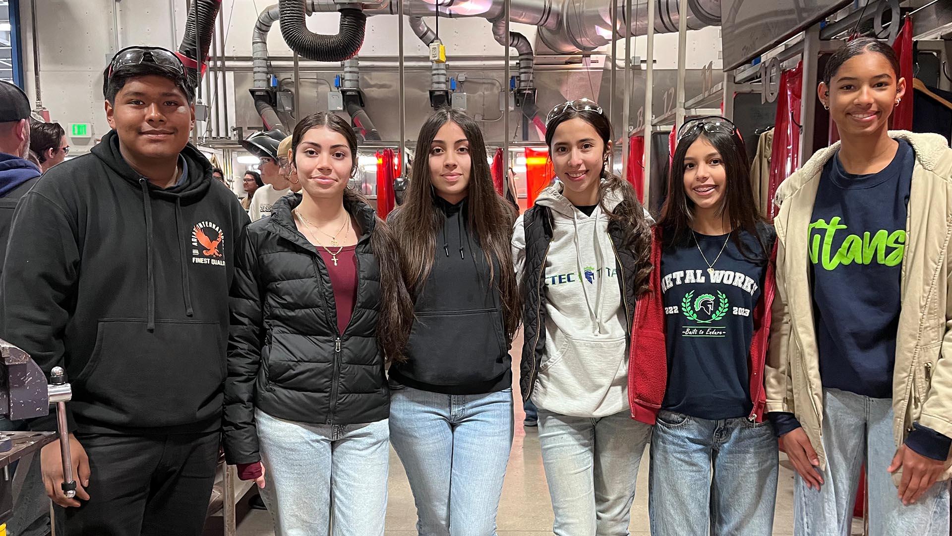 Students are lined up and smiling.