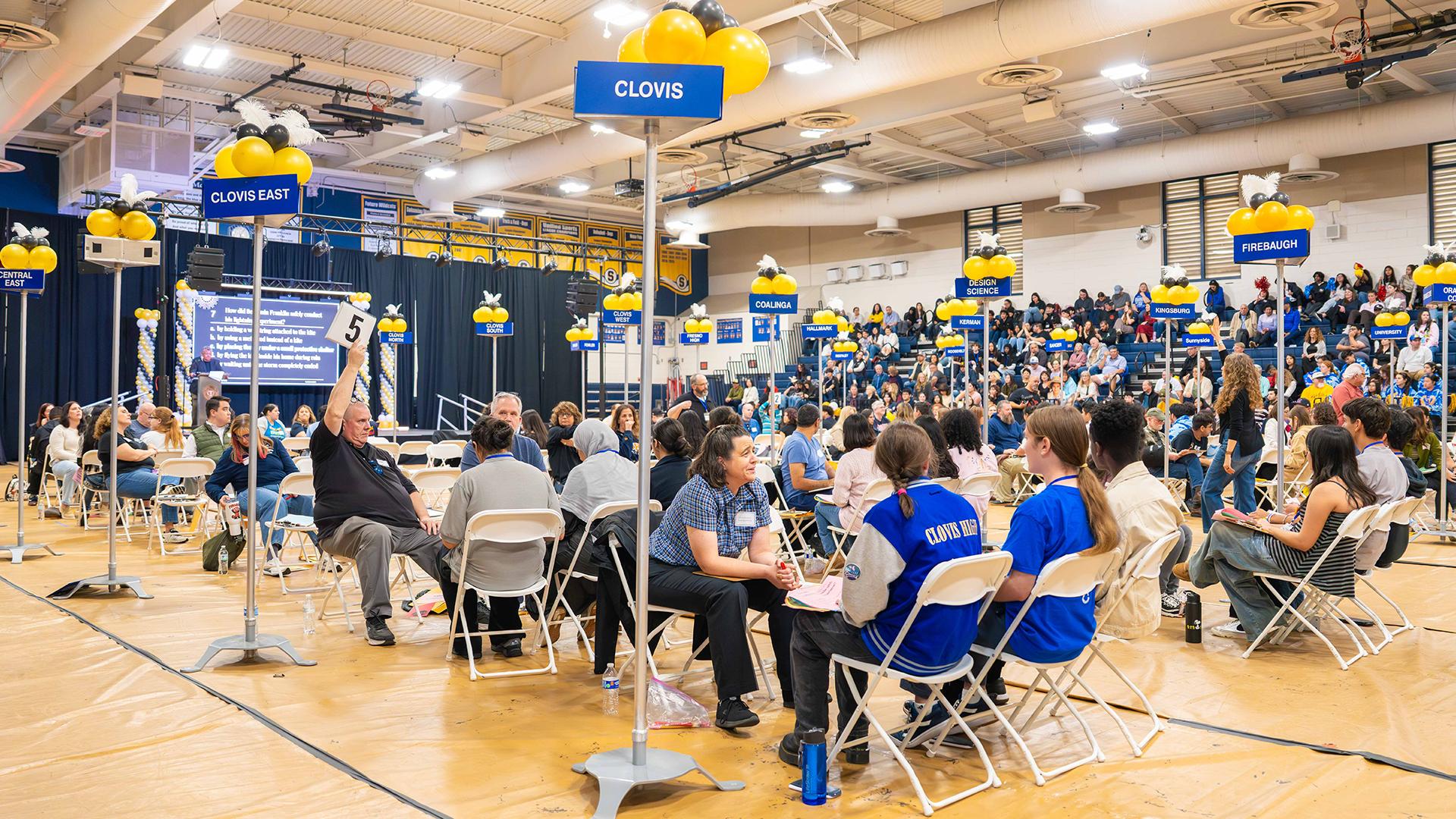 Academic Decathlon teams are participating in the Super Quiz. 