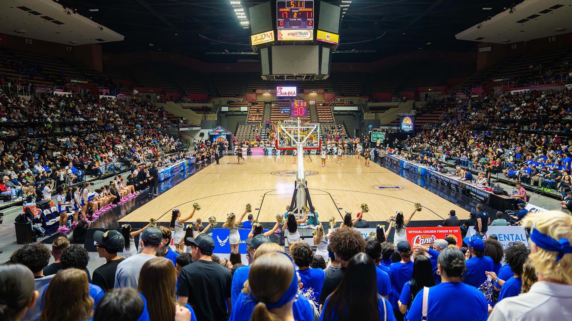 Basketball court with stand full at the Selland Arena. 