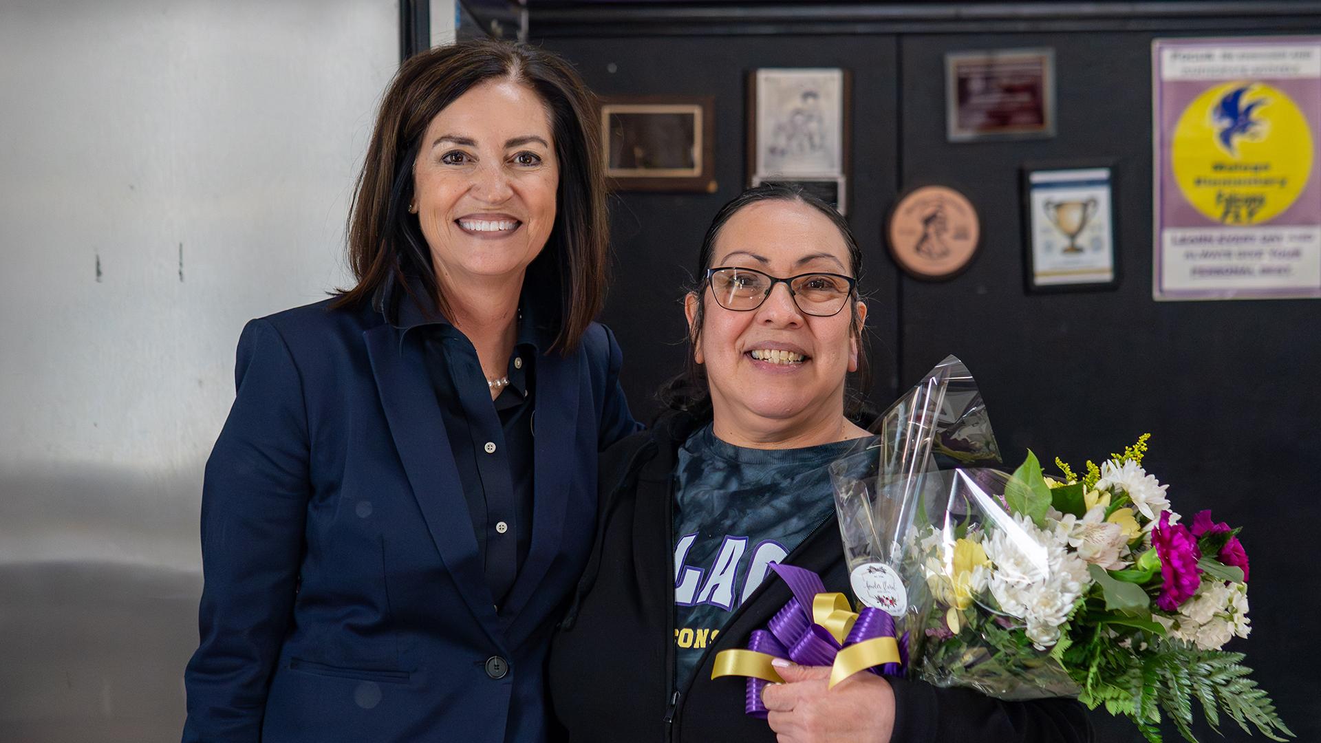 Two people are standing together. 