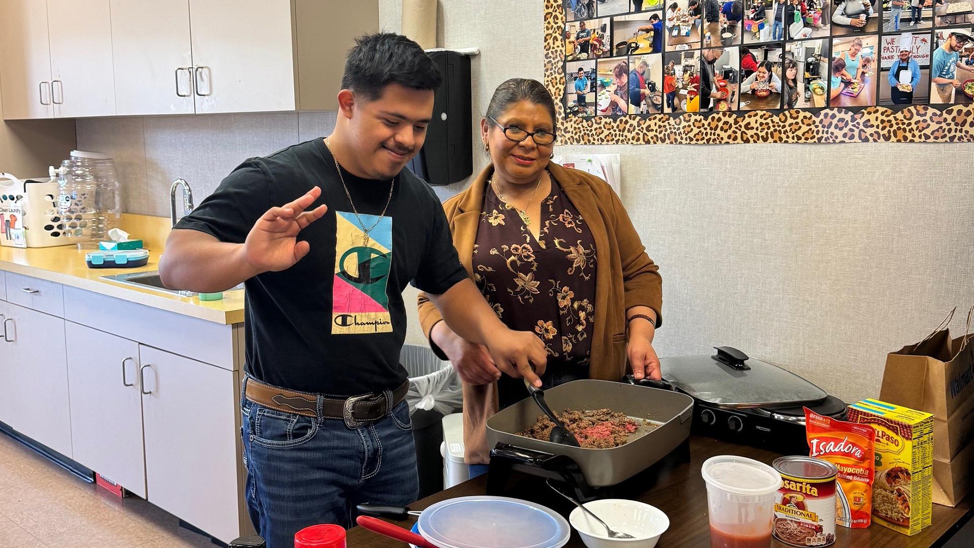 A teacher is with a student. 