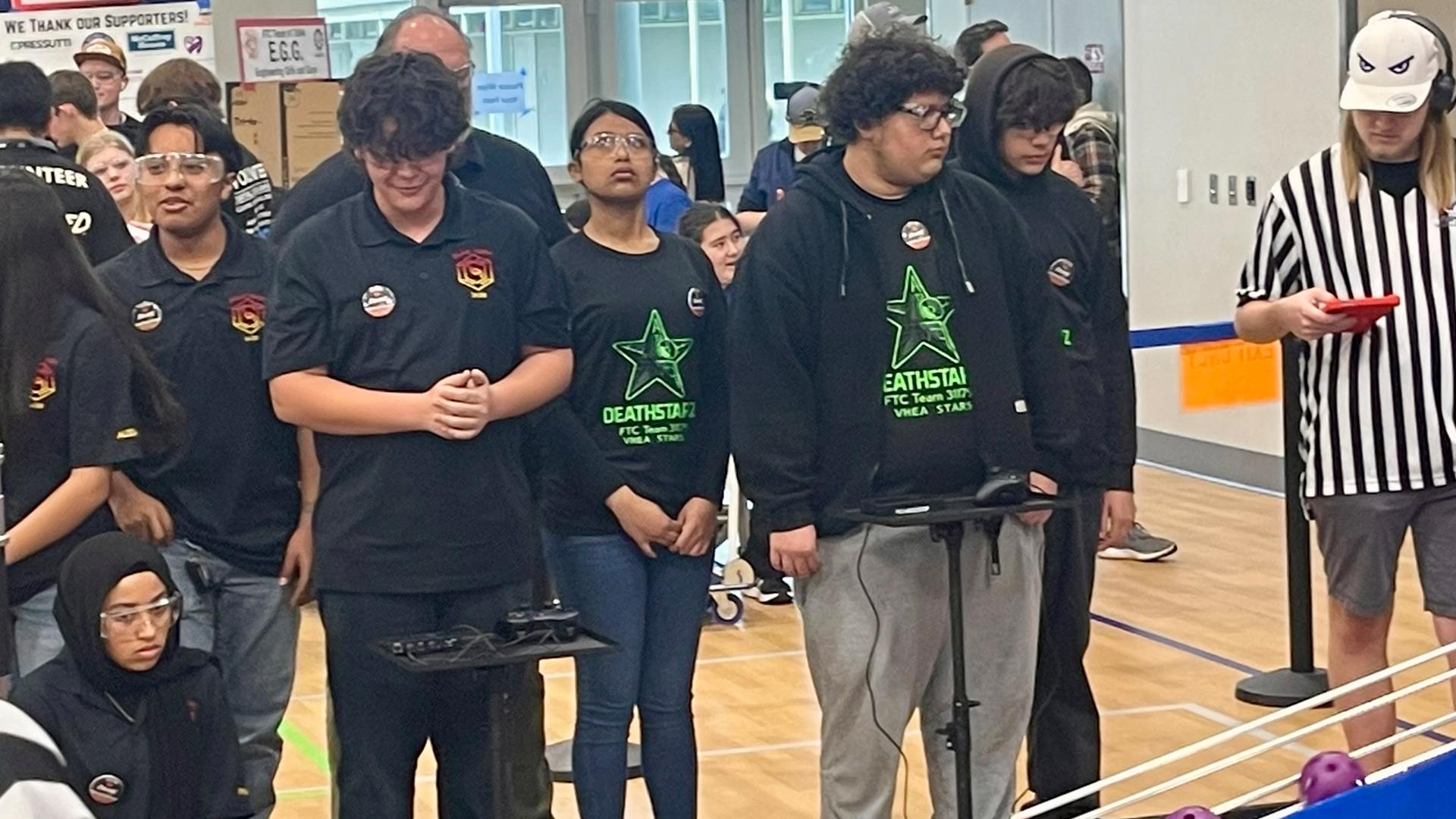 The robotics team is competing. 