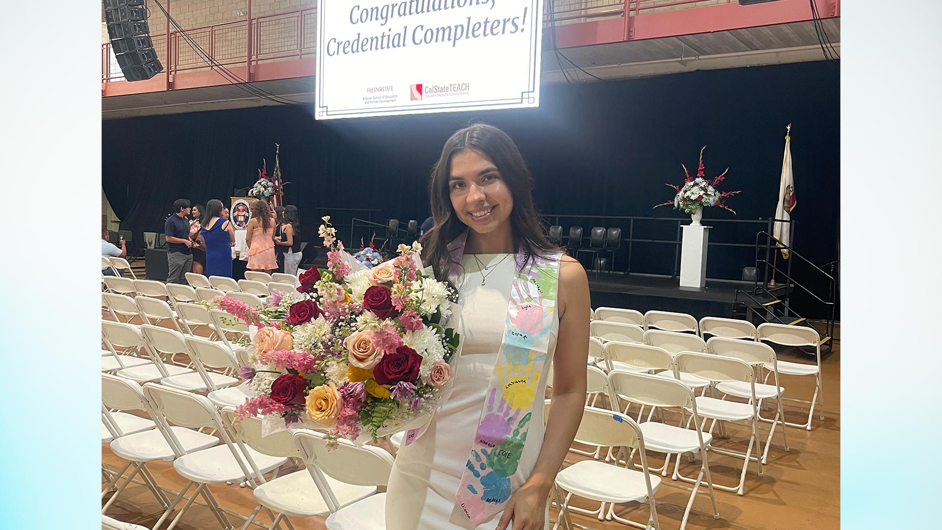 The graduate smiles. 