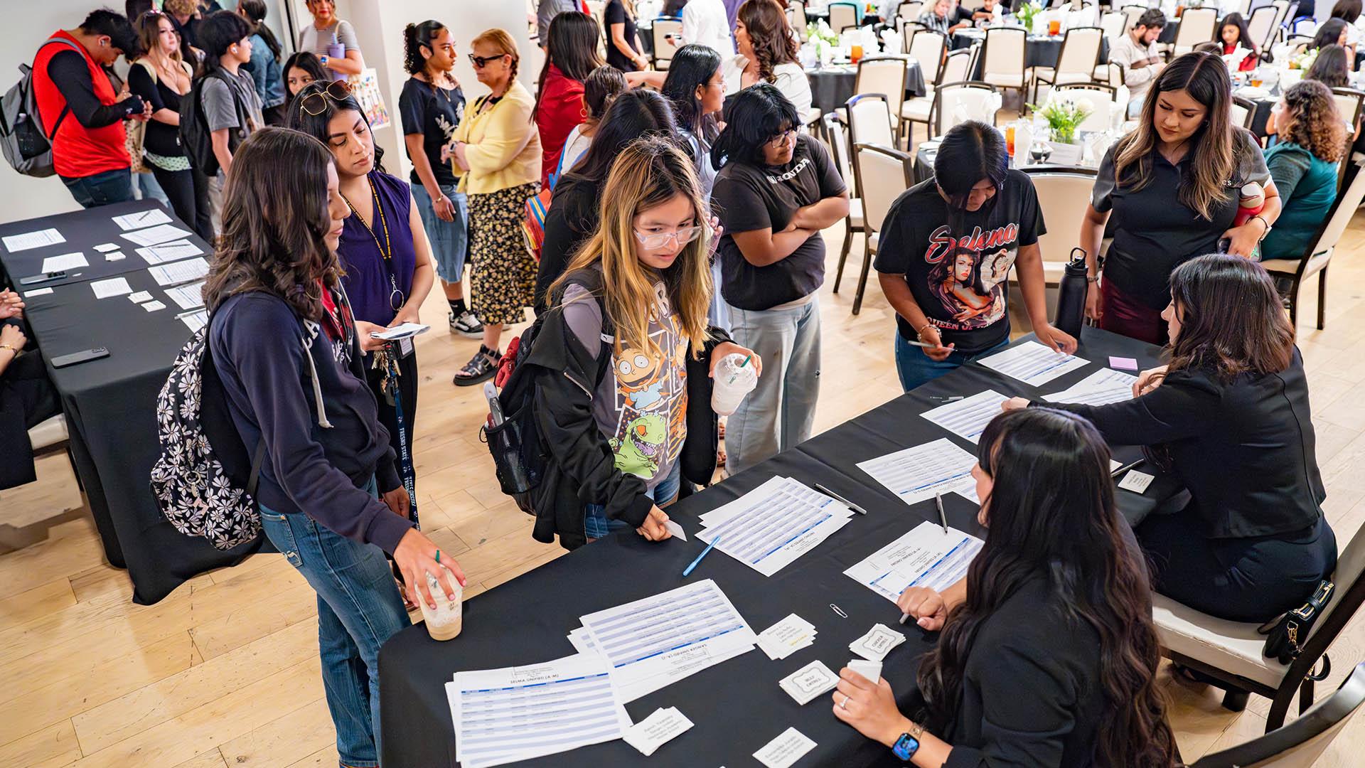 Students check-in at the event. 