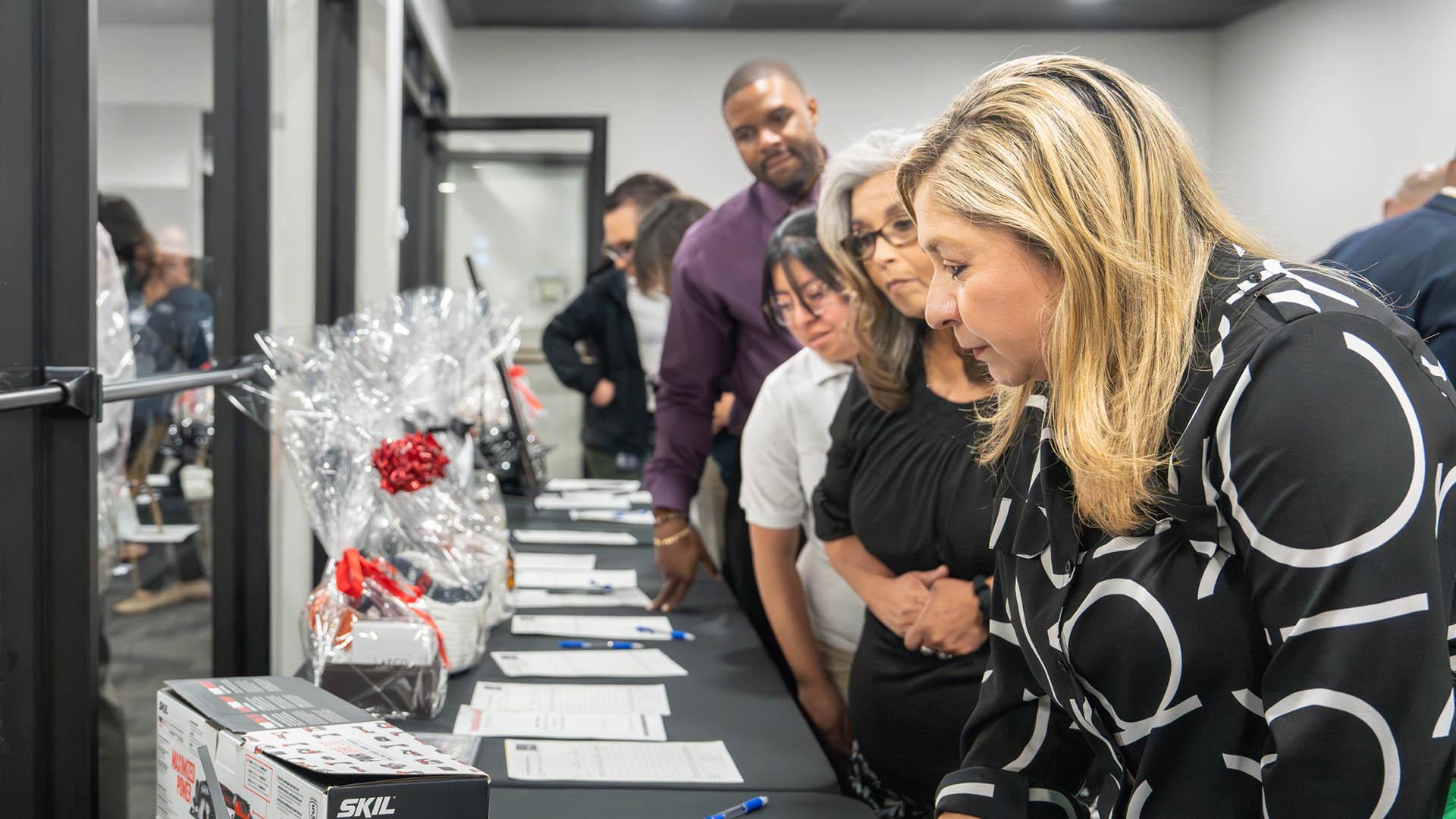 Attendees are bidding on silent auction items. 