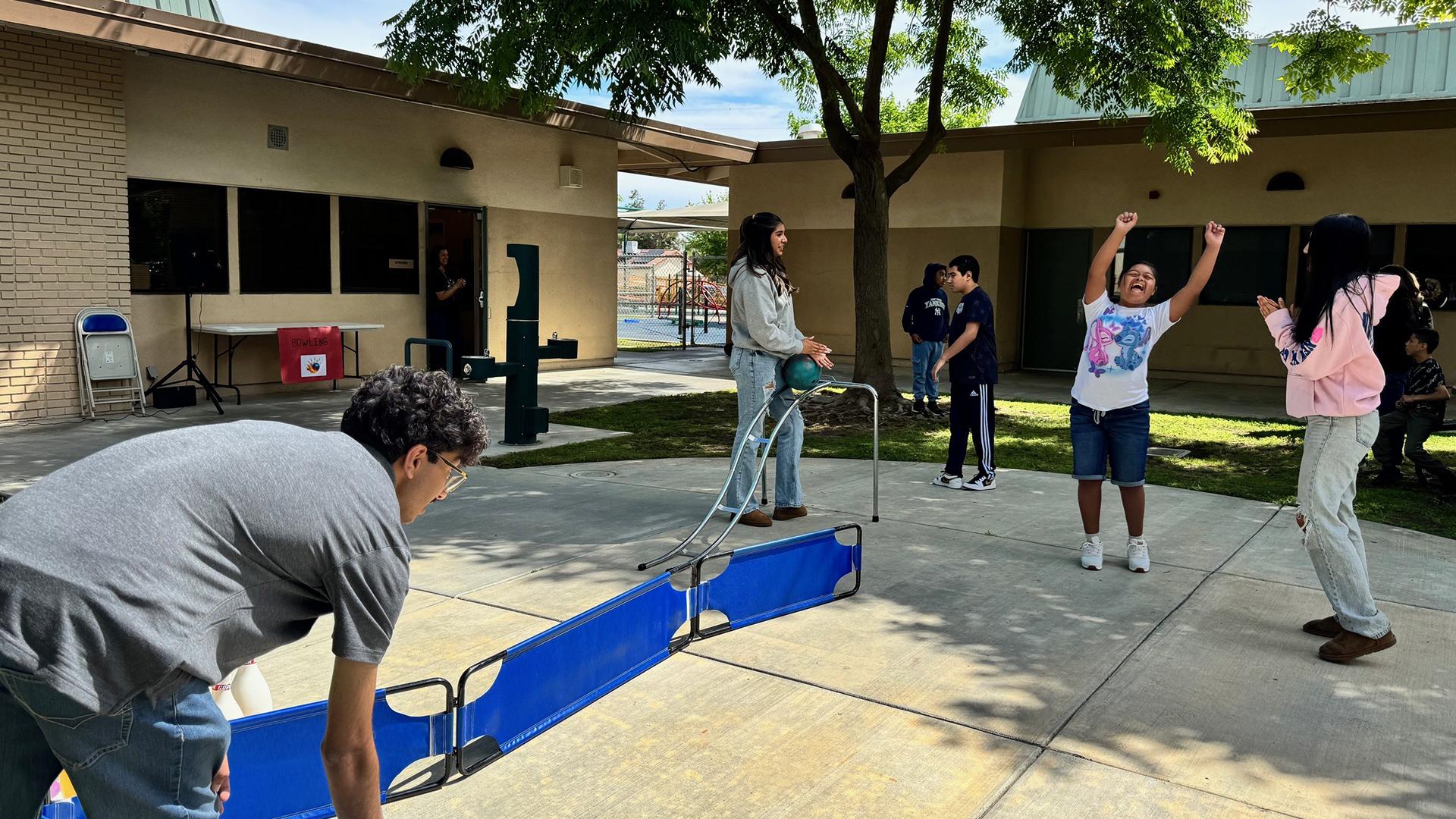 Students are bowling. 