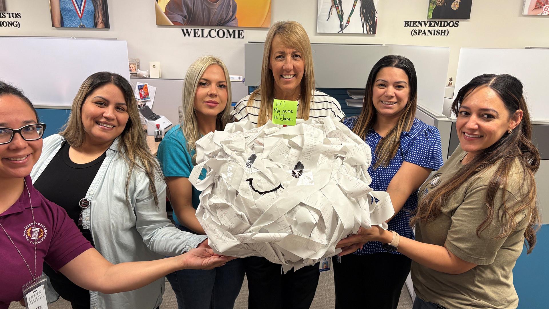FCSS staffers show of their gigantic ball of tape.