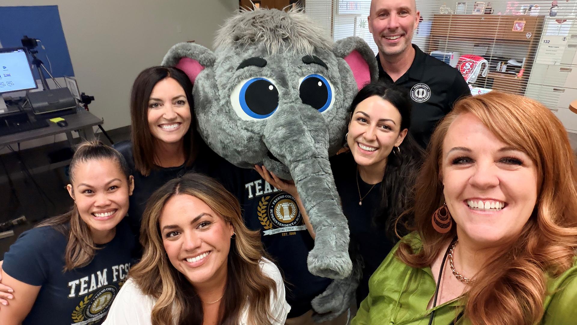 Six coworkers all welcome Eddy, our newest member of Team FCSS.
