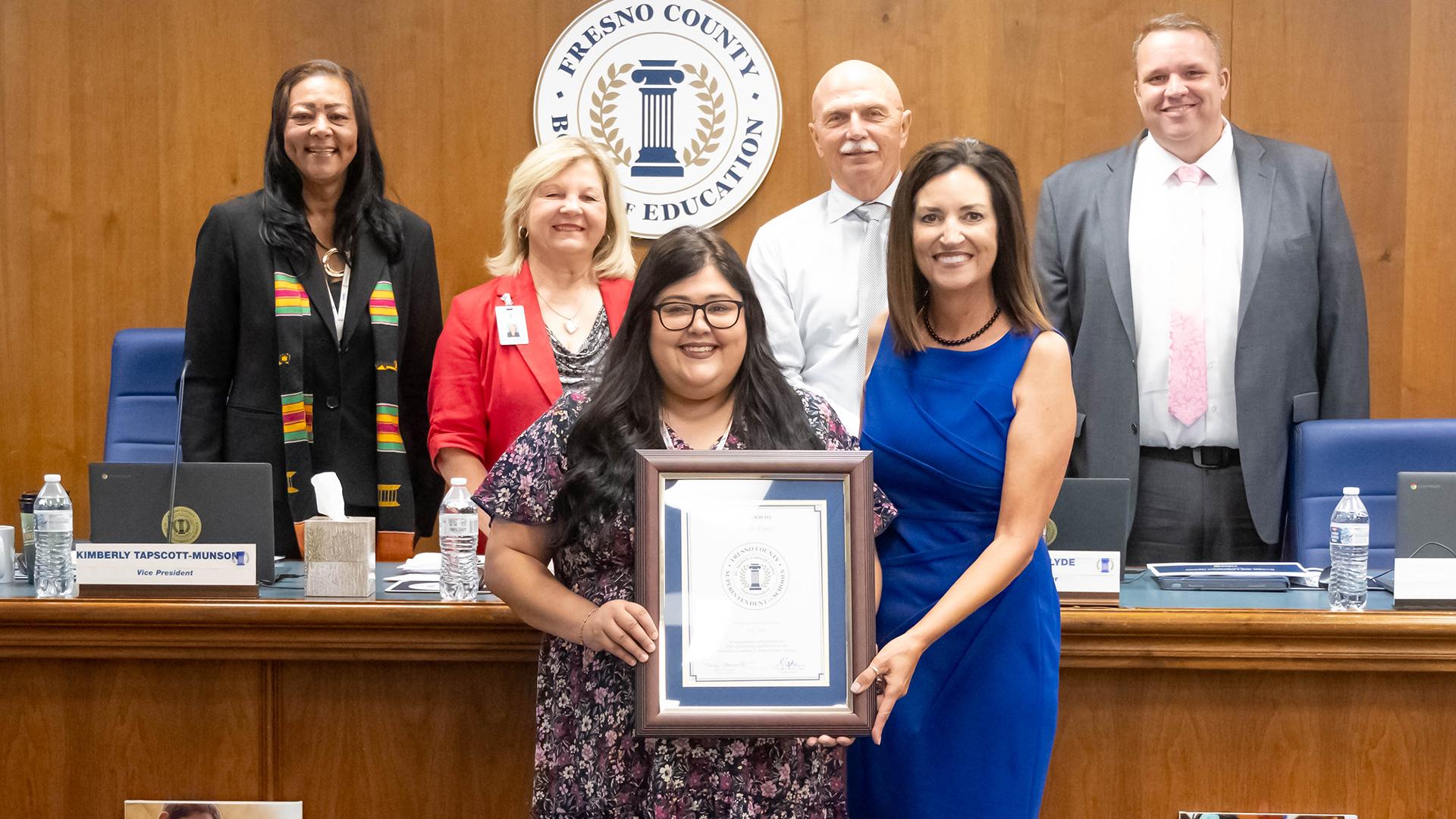 The June Employee of the Month is honored at the monthly board meeting.