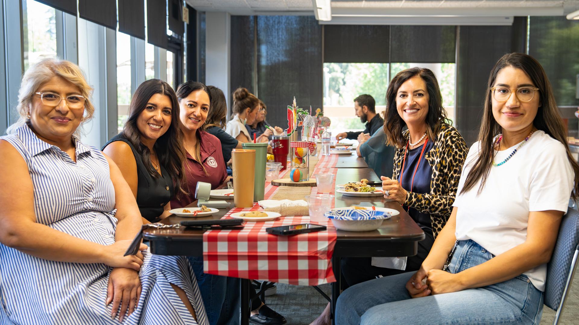 FCSS staffers pose for a picture from the table at the Summer Potluck.