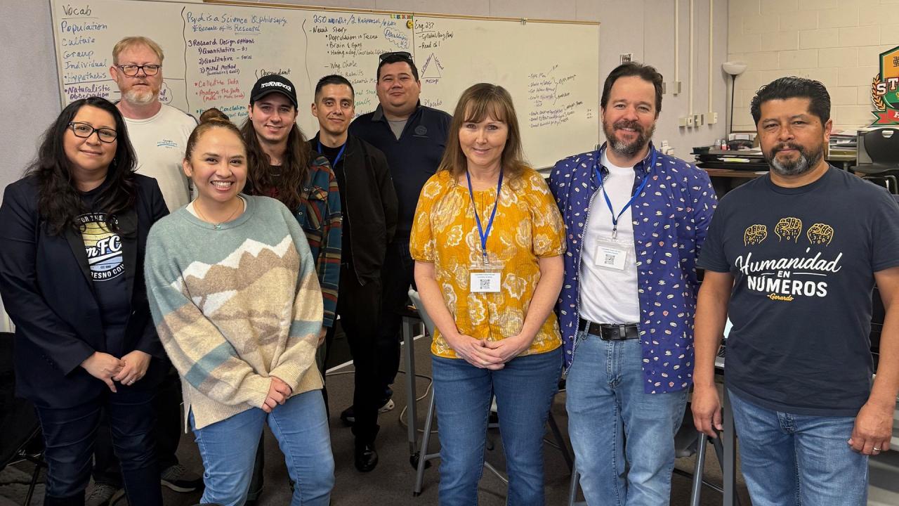 A group of people are smiling. 